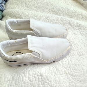 Womens size 9 white Nike slip ons.  Gently used worn only few times.
